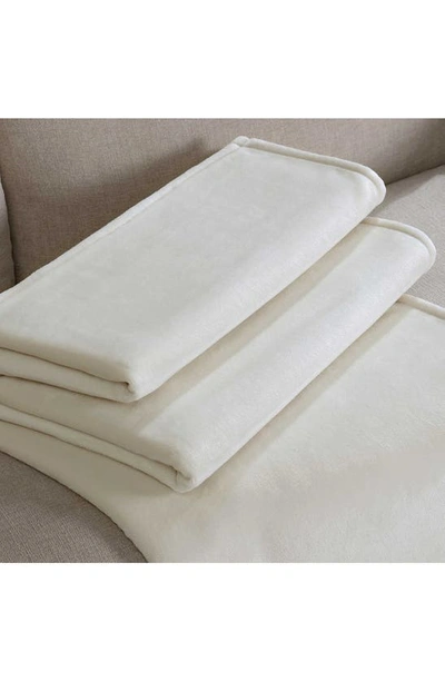 Shop Calvin Klein Core Plush Blanket In Beige/ Tan