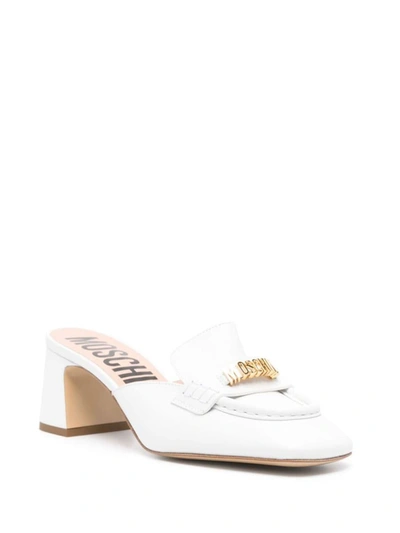 Shop Moschino Sandals In White