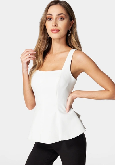 Bebe Thin Strap Peplum Top In White Alyssum
