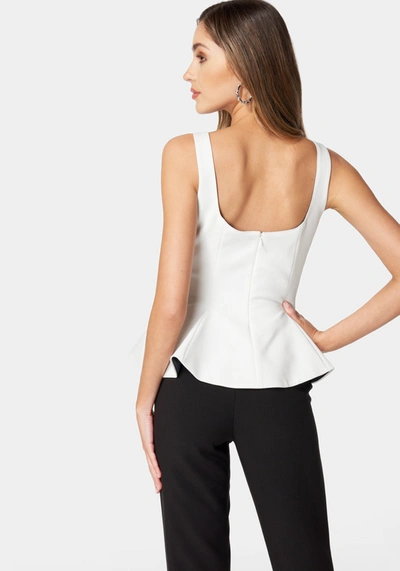 Bebe Thin Strap Peplum Top In White Alyssum