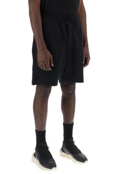 Shop Y-3 French Terry Jogger Bermuda Shorts In Black