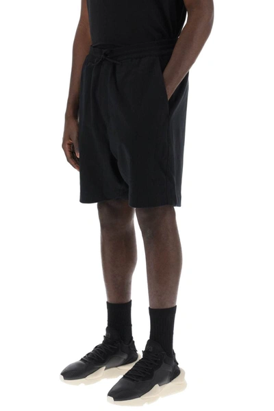 Shop Y-3 French Terry Jogger Bermuda Shorts In Black