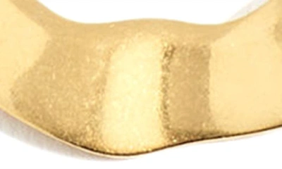 Shop Madewell Wavy Medium Hoop Earrings In Vintage Gold