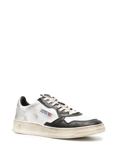 Shop Autry Black And White 'medalist' Low Top Sneakers Distressed Finish In Cow Leather
