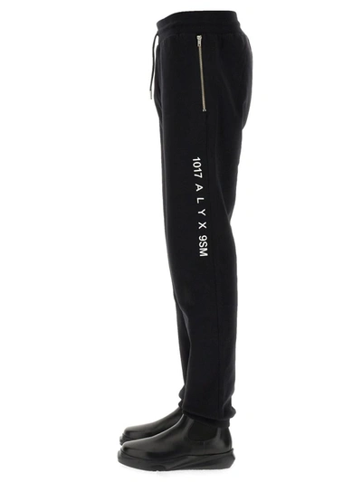 Shop Alyx 1017  9sm Jogging Pants "visual" Unisex In Black