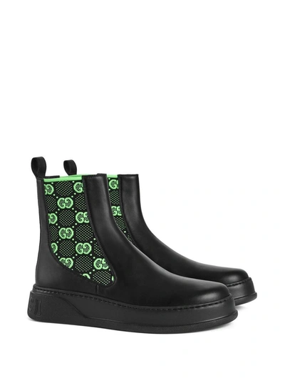 Shop Gucci Gg Motif Leather Ankle Boots In Black