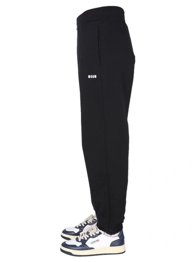 Shop Msgm Jogging Pants With Lettering Logo In Black