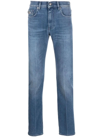 Shop Versace Slim Jeans With Patch In Blue