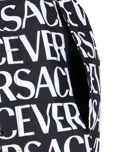 Shop Versace Black Nylon Swimming Trunks In White/black