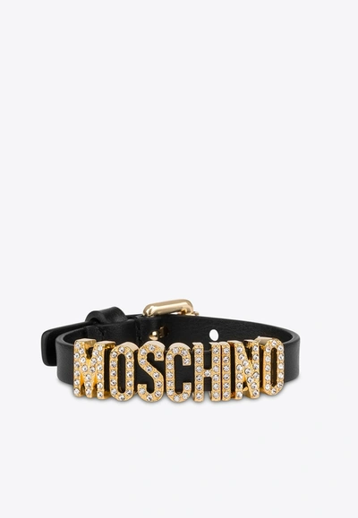 Shop Moschino Crystal Embellished Logo Leather Bracelet In Black