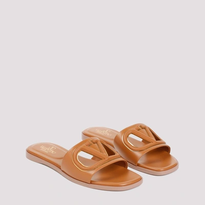 Shop Valentino Garavani  V Logo Cut Out Slides Shoes In Brown