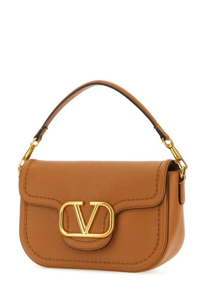 Shop Valentino Garavani Handbags. In Camel