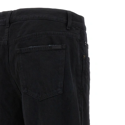 Shop Saint Laurent Long Baggy Denim Jeans