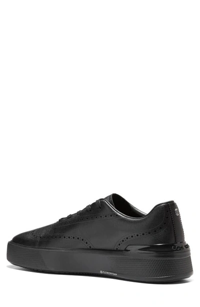 Shop Cole Haan Grandpro Crew Wing Tip Sneaker In Black / Black