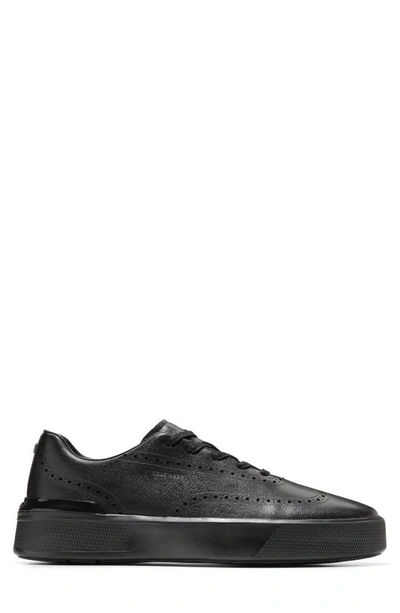 Shop Cole Haan Grandpro Crew Wing Tip Sneaker In Black / Black