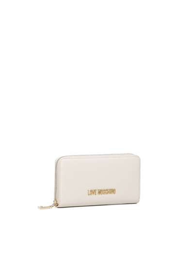 Shop Love Moschino Logo Lettering Zipped Wallet In Ivory