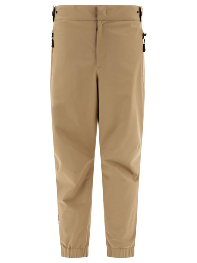 Shop Moncler Grenoble Zipped Pockets Tailored Pants In Beige