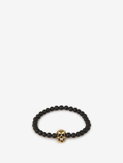 Shop Alexander Mcqueen Skull Beads Bracelet In Black And Gold