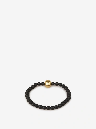 Shop Alexander Mcqueen Skull Beads Bracelet In Black And Gold