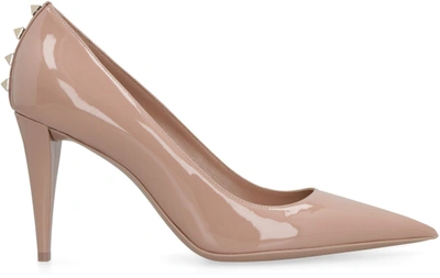 Shop Valentino Rockstud Patent Leather Pumps In Pale Pink