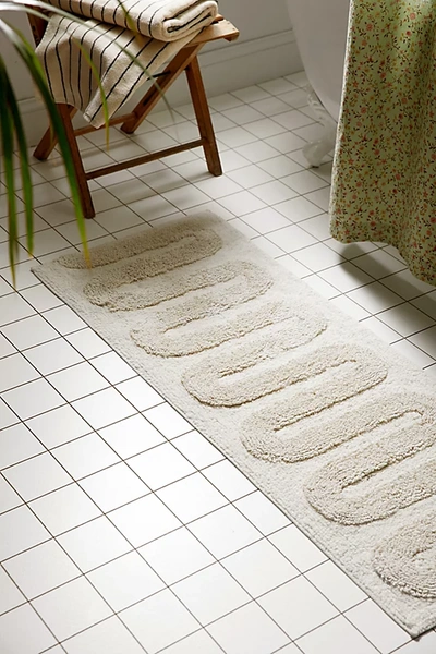 Shop Urban Outfitters Looped Squiggle Runner Bath Mat In Cream At