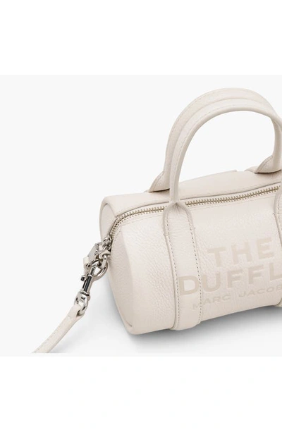 Shop Marc Jacobs The Mini Leather Duffle Bag In Cotton/ Silver