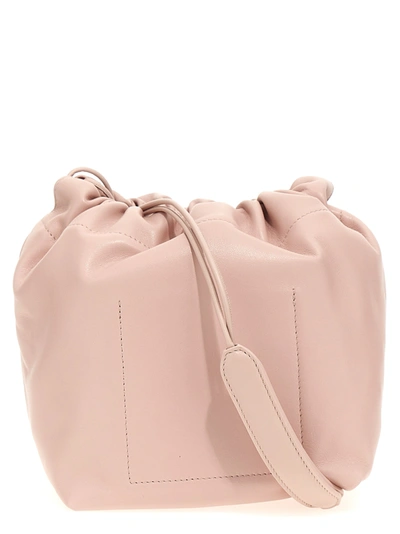Shop Jil Sander Dumpling Crossbody Bags Pink