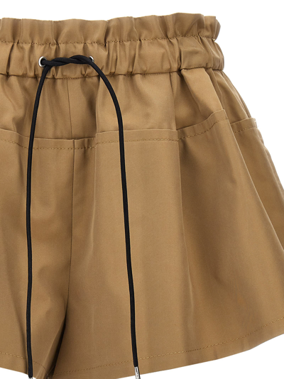Shop Sacai Pleated Shorts In Beige