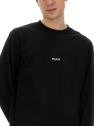 Shop Msgm Rib Trim Logo Sweatshirt In Black