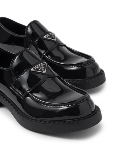 Shop Prada Patent Leather Loafers In Nero