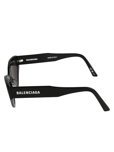 Shop Balenciaga Logo Sided Cat-eye Sunglasses In Black/grey
