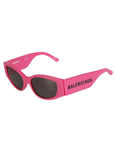 Shop Balenciaga Logo Sided Cat-eye Sunglasses In Fuchsia/grey