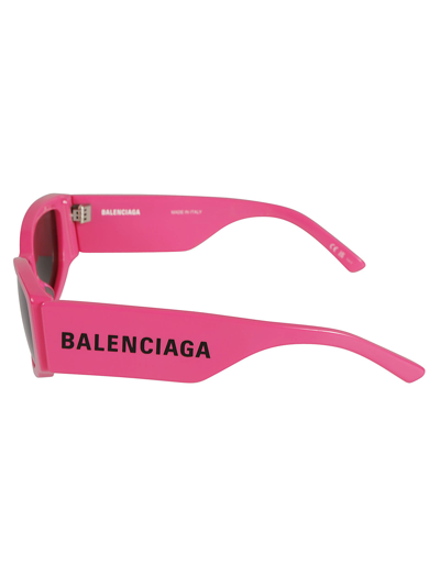 Shop Balenciaga Logo Sided Cat-eye Sunglasses In Fuchsia/grey