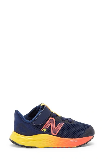 Shop New Balance Kids' Ari Sneaker In Team Navy/ Electric Red