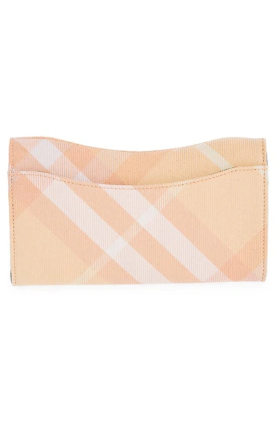 Shop Burberry Rocking Horse Check Continental Wallet In Peach