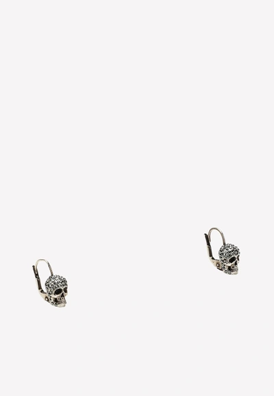 Shop Alexander Mcqueen Crystal-embellished Skull Earrings In Metallic