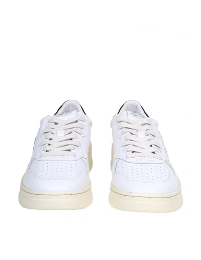 Shop Autry Leather Sneakers In White/black