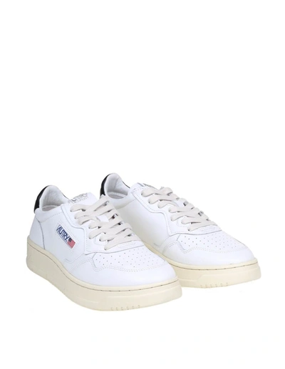 Shop Autry Leather Sneakers In White/black