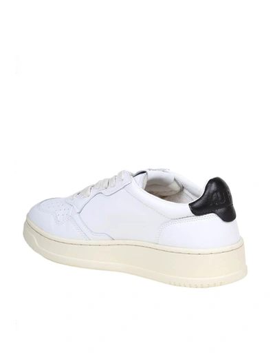 Shop Autry Leather Sneakers In White/black