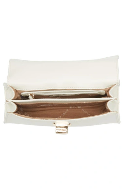 Shop Anne Klein Mini Top Handle Turnlock Bag In Anne White