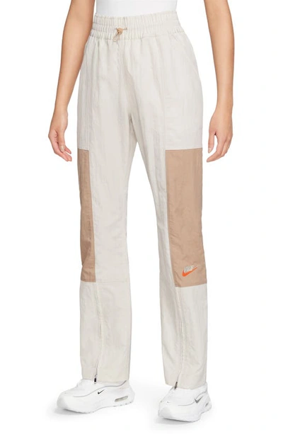 Shop Nike City Utility Zip Cuff Track Pants In Light Orewood Brown/ Hemp