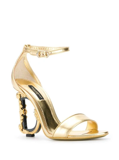 Shop Dolce & Gabbana 'baroque' Gold Colored Sandals With Logo Heel In Leather Woman In Grey