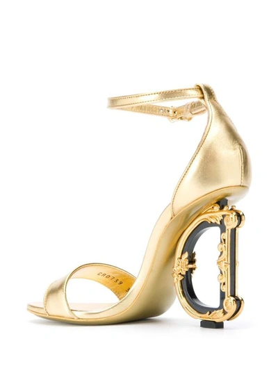 Shop Dolce & Gabbana 'baroque' Gold Colored Sandals With Logo Heel In Leather Woman In Grey