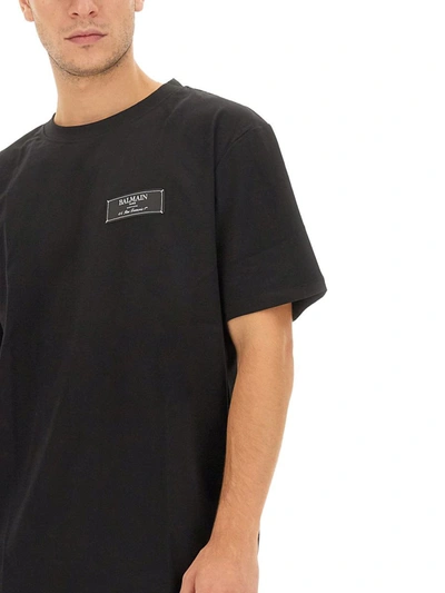 Shop Balmain Logo Label T-shirt In Black