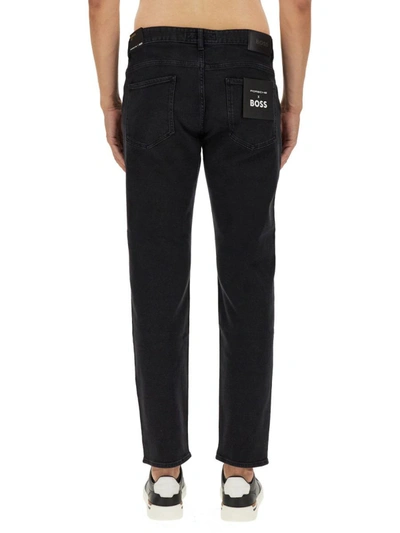 Shop Hugo Boss Boss Tapered Fit Jeans In Black