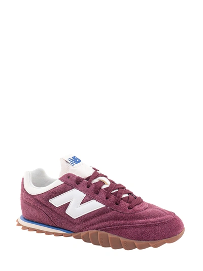 Shop New Balance Suede Sneakers