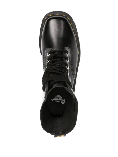 Dr. Martens' Platform Boots With Treaded Sole And Distinctive Accents In Black