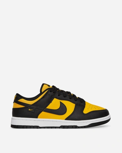 Shop Nike Dunk Low Sneakers Black / University Gold In White