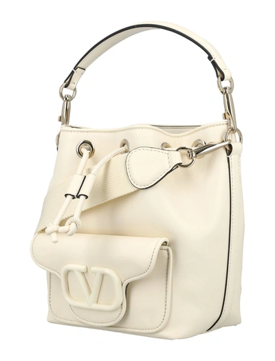 Shop Valentino Garavani Locò Bucket Bag In Ivory