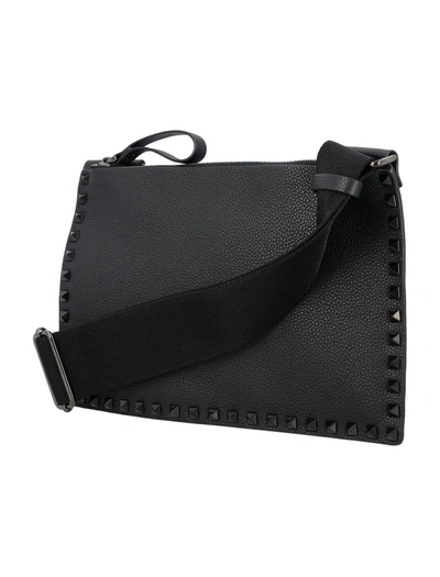 Shop Valentino Garavani Rockstud Flat Crossbody Bag In Black